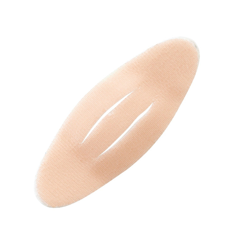 A single peach-colored silicone plaster with a textured surface, shown diagonally on a solid white background.