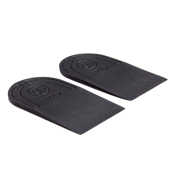 A pair of black heel lifts with embossed logo and text, displayed on a clean white background.