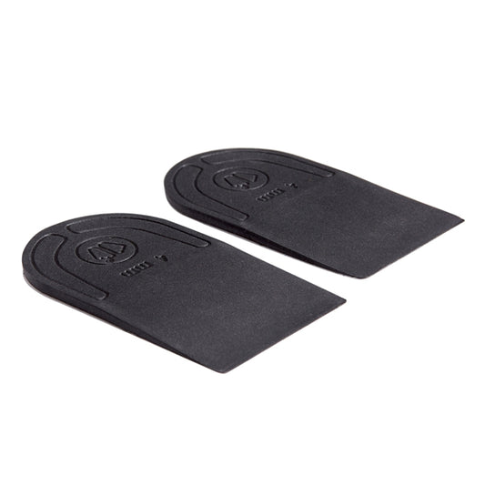 A pair of black heel lifts with embossed logo and text, displayed on a clean white background.