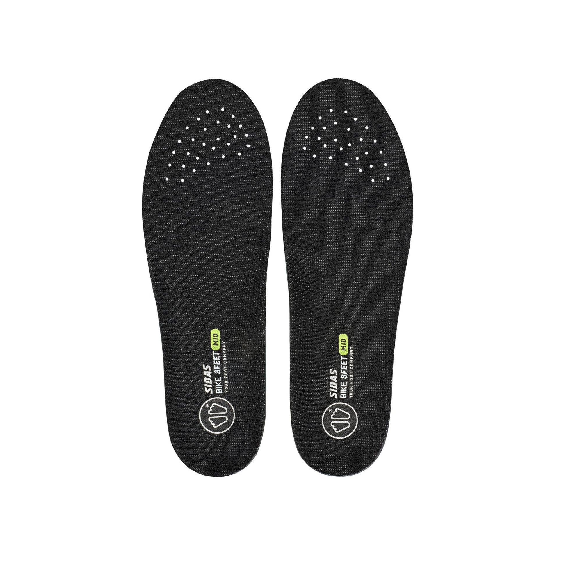 Pair of black shoe insoles on a white background