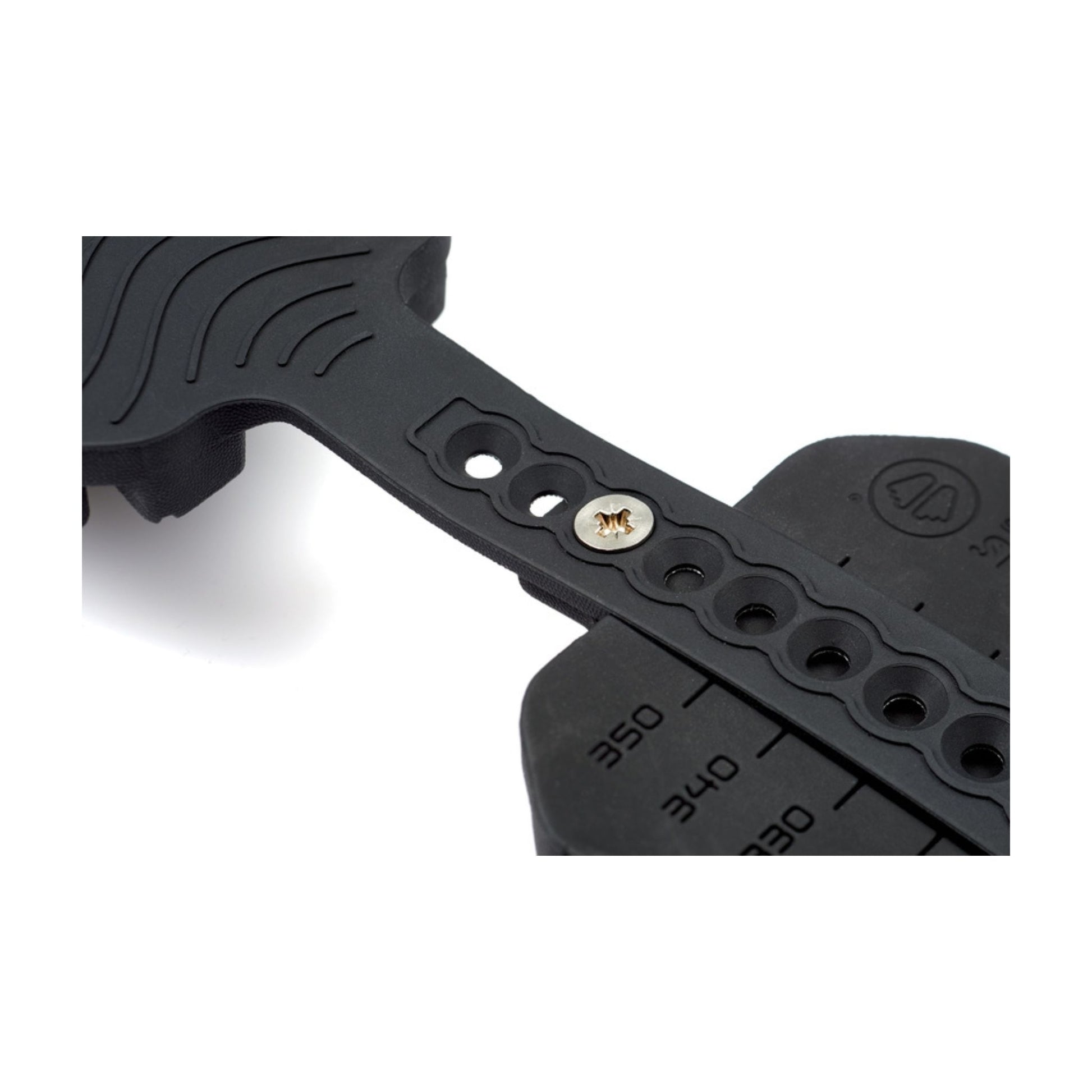 Black metal tool with measurement markings on a white background
