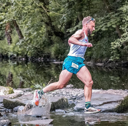 Trail Ultra Race Socks being worn across a river