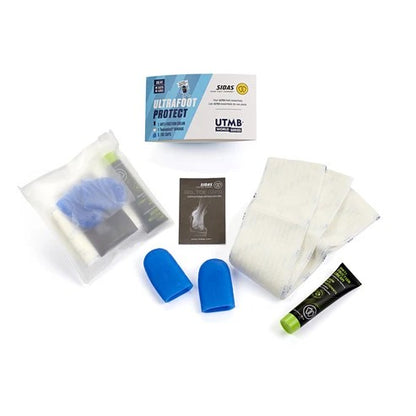 Collection of foot care products including socks, cream, and packaging on a white background
